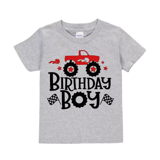 Gray t-shirt with red monster truck and 'Birthday Boy' text on a white background.