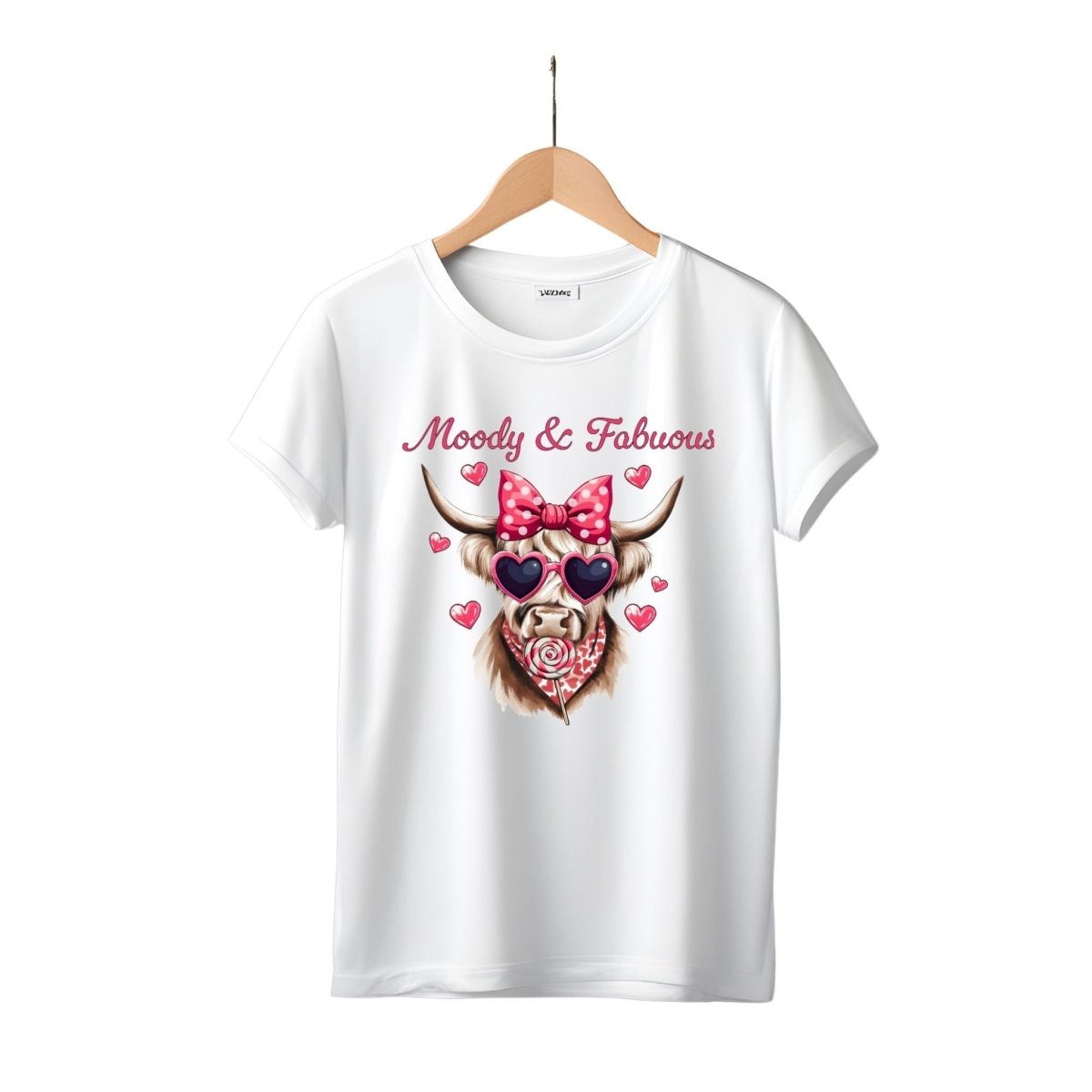 white tshirt with pink highland cow in pink heart sunglasses, hair bow, bandana, and sucker moody and fabulous on front. Little Gift Nook