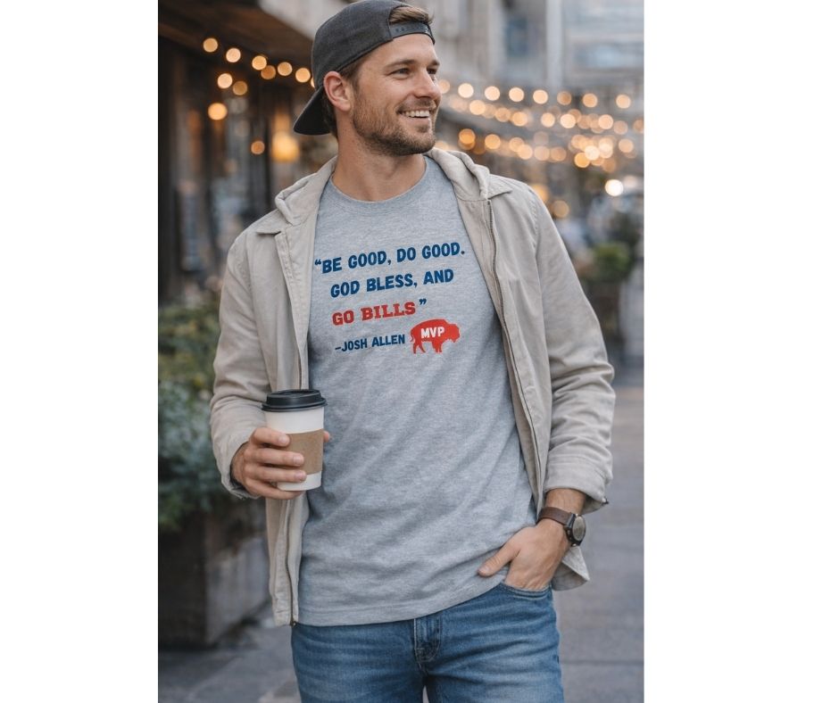Man wearing a gray t-shirt with mvp quote "be good, do good" holding coffee in outdoor background.