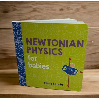 Book titled 'Newtonian Physics for Babies' by Chris Ferrie standing on a wooden surface.