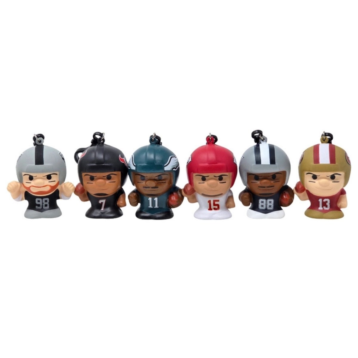 Six potential 2026 NFL SqueezyMates collectible slow rise football players from mystery bags. Figures sitting on white background. 
