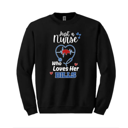Black sweatshirt with white red and blue text "Just a nurse who loves her BILLS" and stethoscope with red buffalo in center of heartbeat. Shirt is laying on white background. 