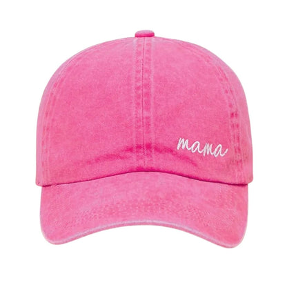 Mama pink embroidered baseball hat sitting on white background.