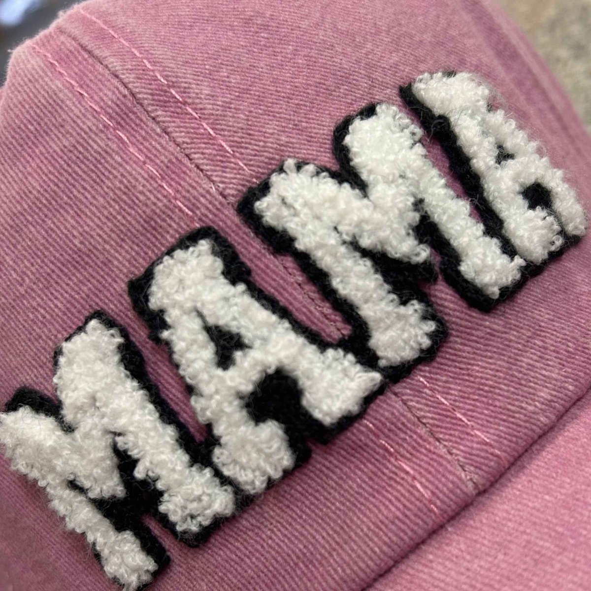 Close up of pink sherpa MAMA letters baseball hat.