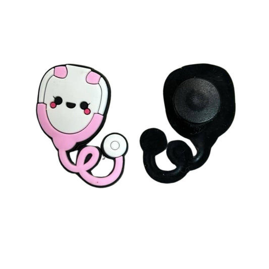 Pink white smiling face stethoscope shoe charm to fit croc like shoes. Front and back of charm on white background. Little Gift Nook