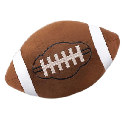 Plush 12" football pillow sitting on white background.