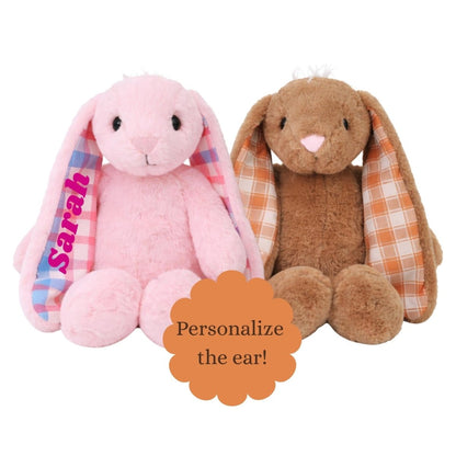 Two plush bunny toys, one pink and one brown, with plaid ears one personalized with name Sarah sitting on a white background. Little Gift Nook