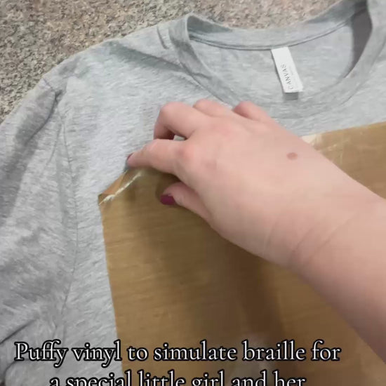 Video of custom t-shirt with puffy vinyl to simulate "braille" lettering on a shirt for a customer request at the Little Gift Nook Jamestown, NY 