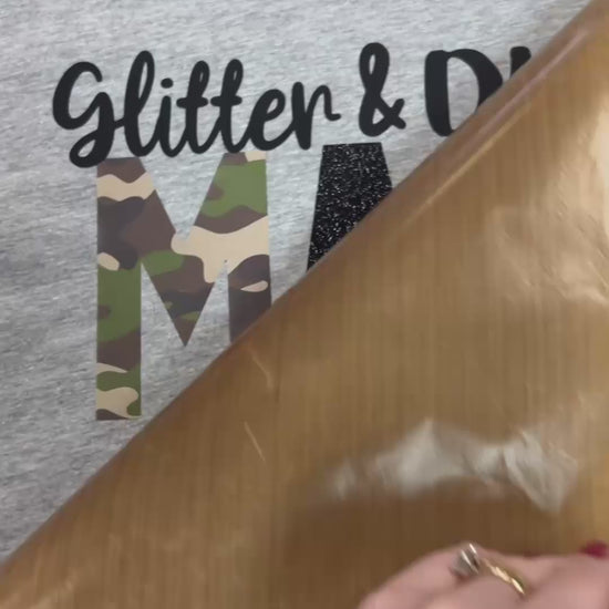 Video of custom t-shirt pressed with Glitter and Dirt Mama of both with black and camo lettering at the Little Gift Nook in Jamestown, NY.