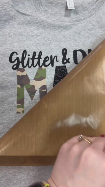 Video of custom t-shirt pressed with Glitter and Dirt Mama of both with black and camo lettering at the Little Gift Nook in Jamestown, NY.