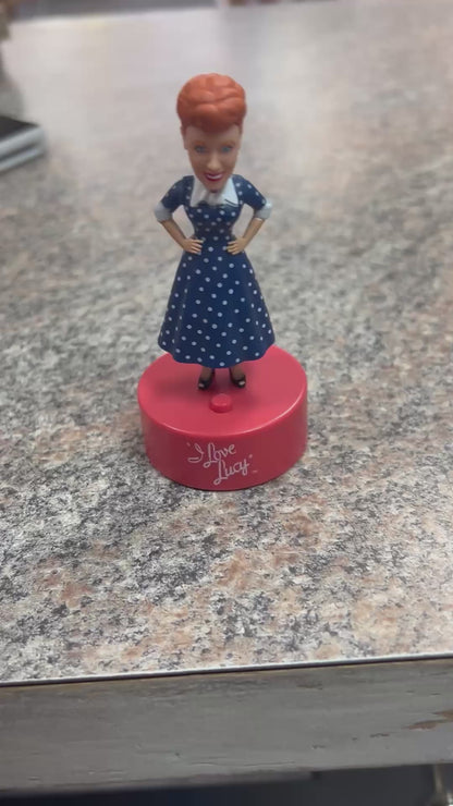 Video of Lucille Ball talking mini bobble head figure sitting on countertop in the Little Gift Nook shop.