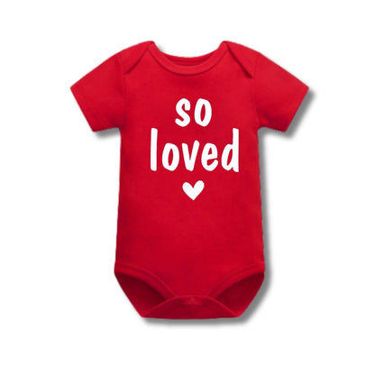 Red baby onesie with 'so loved' text in white on front with heart sitting on white background. Little Gift Nook