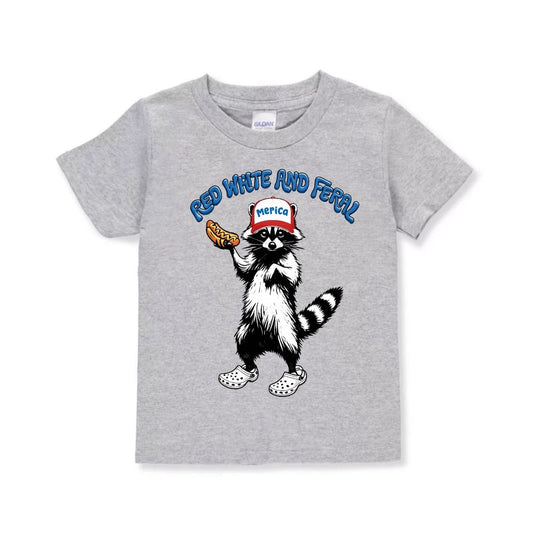 Heather gray toddler 4th of July tshirt "Red, white, and Farel" raccoon holding hot dog in crocs with hat that says "Merica" sitting on white background - Little Gift Nook.