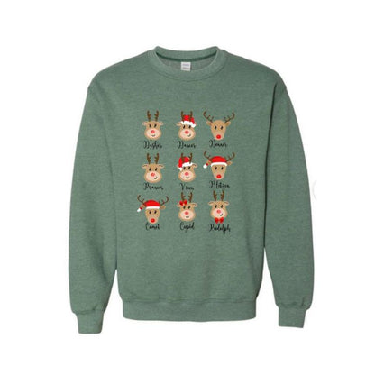 Reindeer Holiday Green Crewneck Sweatshirt. Soft forest green color.  Fleece lined. Reindeer faces on front with their names under. Little Gift Nook.