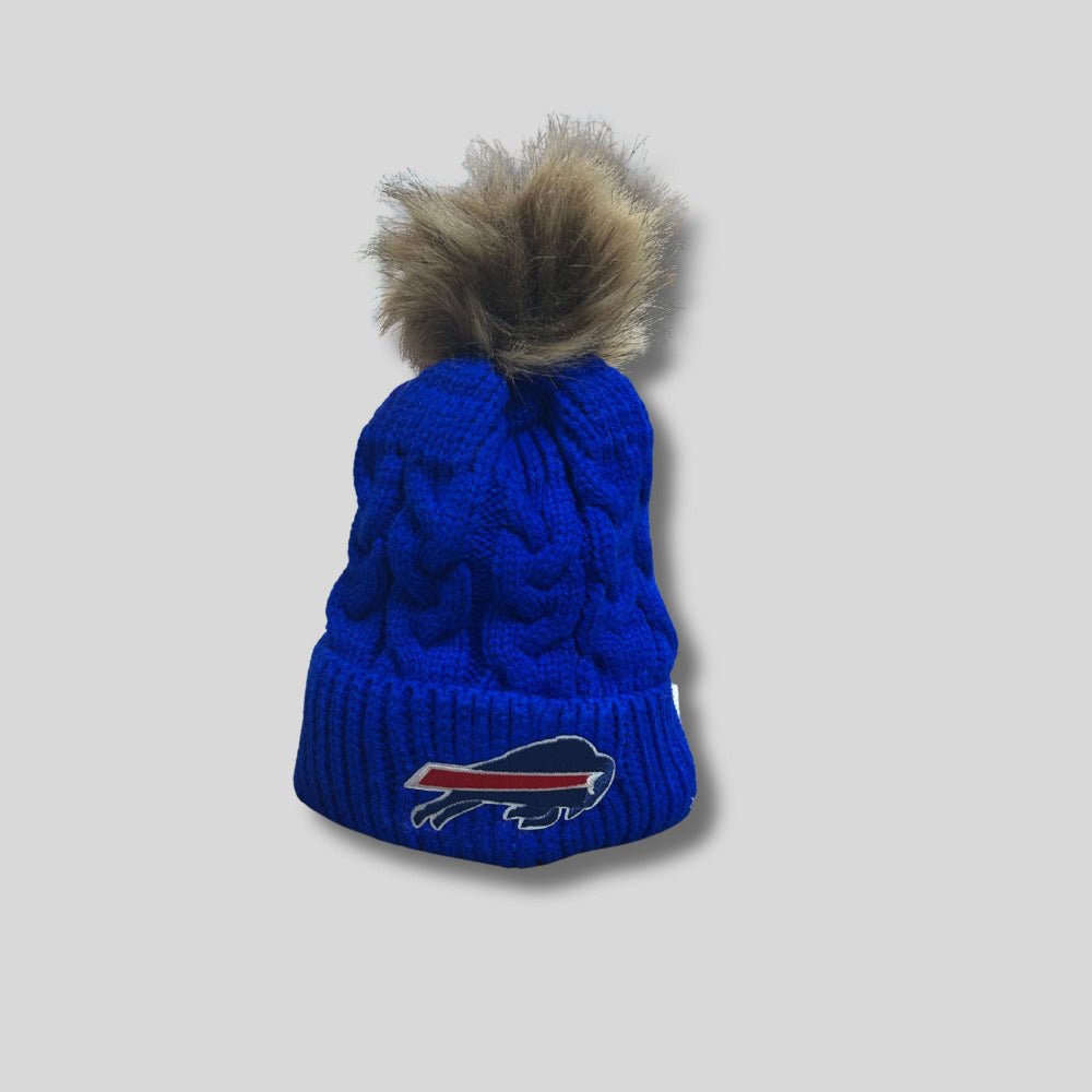 royal blue baby buffalo football pom hat on gray background. 