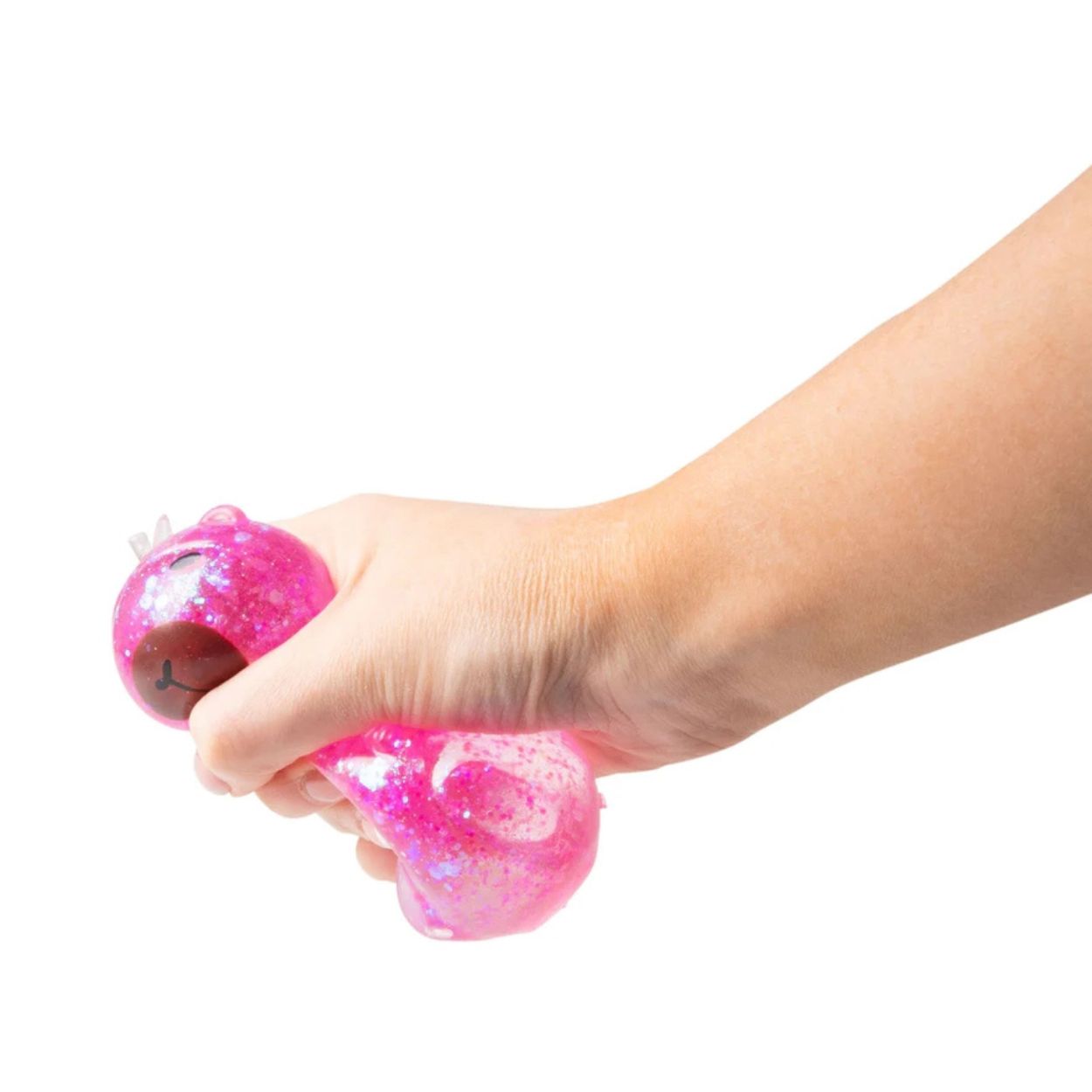 Scrunchems® Sugar Capybara Squishy Fidget Toy in pink being squished by hand on white background.