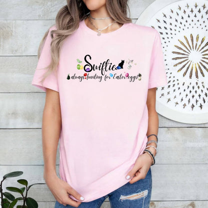 Swiftie pink always hunting for Easter eggs tshirt on model. . Little Gift Nook.