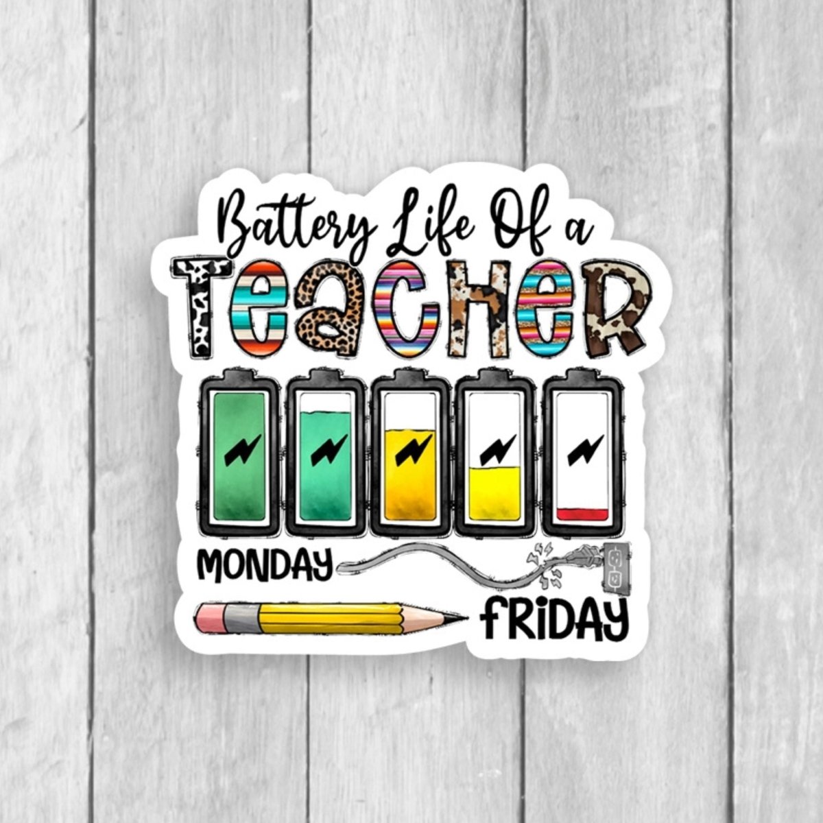 Battery Life of a Teacher colorful sticker on white background sitting on gray wood background. Little Gift Nook