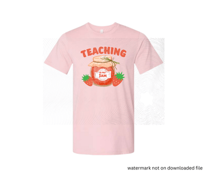 Pink t-shirt with a graphic of a jar of jam and strawberries, text 'Teaching is my jam', on a white background.