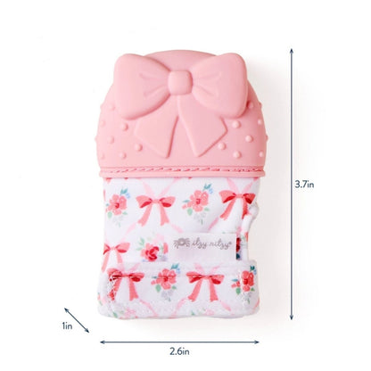 Itzy Mitt wearable pink bow silicone teething mitt teether size sitting on white background.