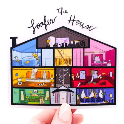 illustrated dollhouse style sticker with cats in each room "The Loafer House" being held up on white background. Little Gift Nook