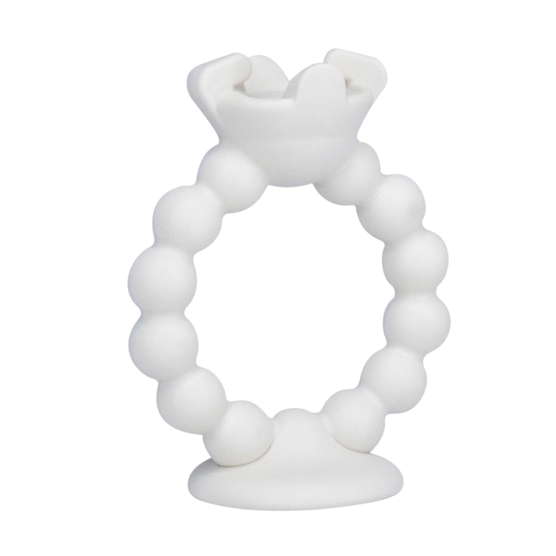 White teething ring attachment for Teething Egg sitting on white background.