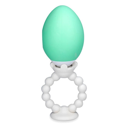 The Teething Egg The Grippie Ring attachment holder connected to mint green Teething Egg on a white background.