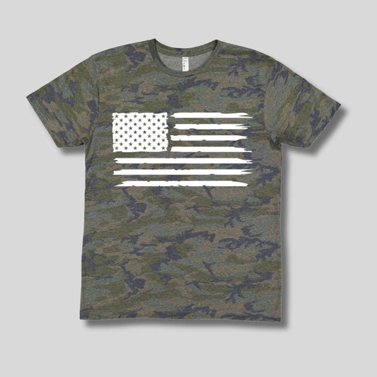 Child's green navy camo tshirt with white american flag image on front laying on light gray background.