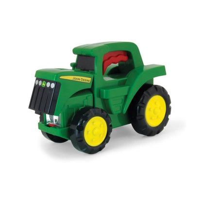TOMY John Deere flip open tractor flashlight toy on white background. 