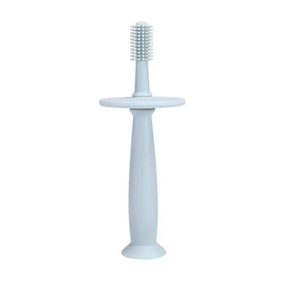 ToothieBrush Baby & Toddler Toothbrush in Green with a stopper standing on white background.