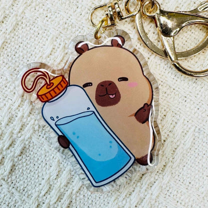 Capybara with water bottle Capybara Acrylic Keychains. Double sided. Comes with metal ring and hook. Little Gift Nook.