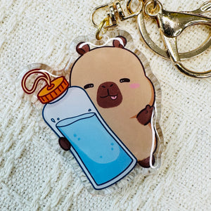 Capybara with water bottle acrylic keychain. Little Gift Nook.