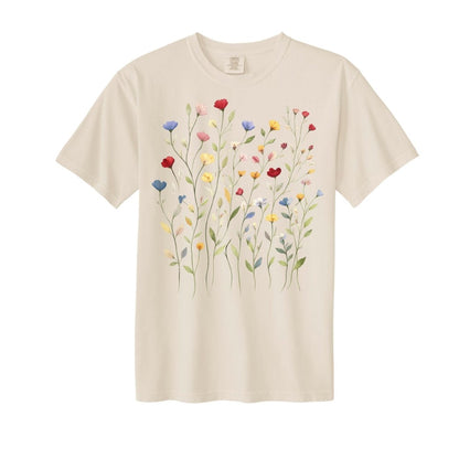 Beige adult short sleeved tshirt with colorful wildflowers on front sitting on white background.