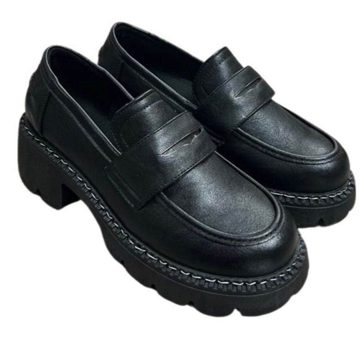 Woman's Black Chunky Platform oxford style slip on shoes on white background.