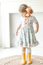 Load image into Gallery viewer, Blue Pink Bunny Eyelet Twirl Dress Easter Girls on model.