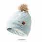 Baby Blue super soft & stretchy knit pom pom hat with tan furry pom pom at top.  Fits kids to adults. Little Gift Nook.