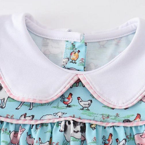 On the Farm Blue Pink Gingham Collar Pocket Dress. Collar sleeveless farm theme dress with cows and pigs. - Little Gift Nook