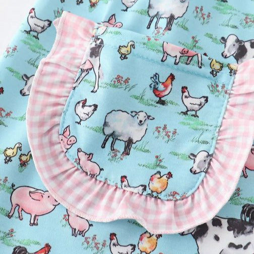 On the Farm Blue Pink Gingham Collar Pocket Dress. Close up of front ruffle pocket.  - Little Gift Nook