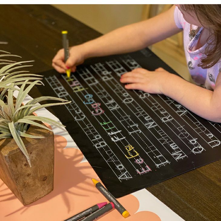 Imagination Starters Reusable Letters Practice Placemat using colored wipe off crayons.- Little Gift Nook