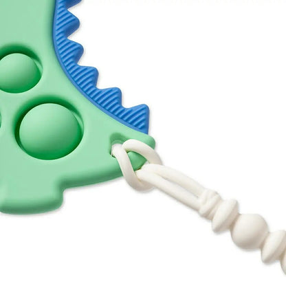 Itzy Pop Dinosaur Teether close up of tail with cilp hole - Little Gift Nook