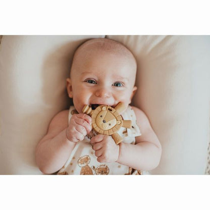 baby teething on Itzy Ritzy Lion Baby Molar Teether with 7 textured tubes sticking out from body base - Little Gift Nook