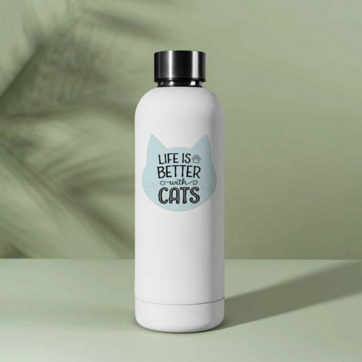 Life is Better with Cats Waterproof Sticker. Baby blue cat face shaped sticker with Life is better with cats on front in black text on water bottle. Little Gift Nook.
