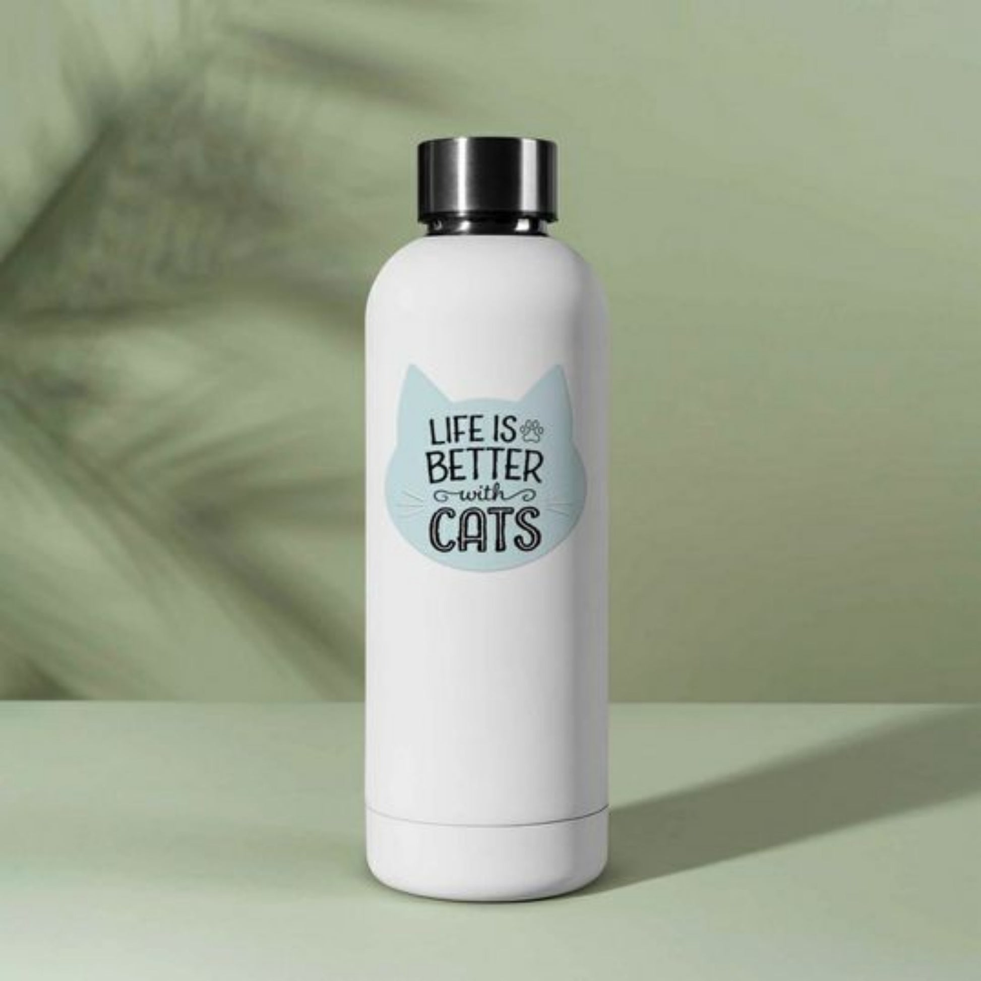Life is Better with Cats Waterproof Sticker. Baby blue cat face shaped sticker with Life is better with cats on front in black text on water bottle. Little Gift Nook.
