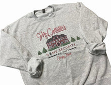 Load image into Gallery viewer, McCallister&#39;s Home Security est. 1990 gray crewneck sweatshirt ~ Adult sizes. Has graphic of house, Christmas tress and Home Security has lock in place of letter O. Cute funny play on Home alone movie. 