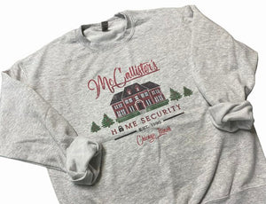 McCallister's Home Security est. 1990 gray crewneck sweatshirt ~ Adult sizes. Has graphic of house, Christmas tress and Home Security has lock in place of letter O. Cute funny play on Home alone movie. 