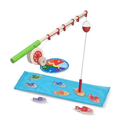 Melissa & Doug Catch & Count Fishing Game. Wooden fishing pole that magnetically catches wooden colored numbered fish. Includes spinning dial and pretend blue fabric as water.- Little Gift Nook
