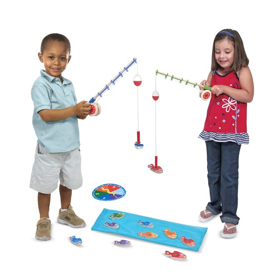 Melissa & Doug Catch Count Fishing Game. Wooden magnetic play set complete with working wind-up reel! Makes cute birthday or Easter gift.. 2 kids playing fishing game.  Comes with spinner wheel, 2 rods with magnets, 10 wooden colored numbered fish, and blue material as water. - Little Gift Nook 