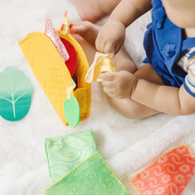 Load image into Gallery viewer, Melissa &amp; Doug Fill &amp; Spill Soft Taco Textured Baby Toy.