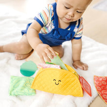 Load image into Gallery viewer, Melissa &amp; Doug Fill &amp; Spill Soft Taco Textured Baby Toy.