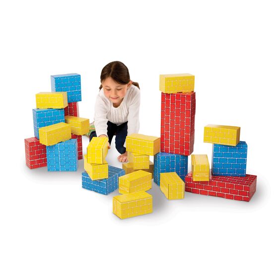 Child building with the Melissa & Doug Jumbo Blocks set. 24 piece cardboard blocks.- Little Gift Nook